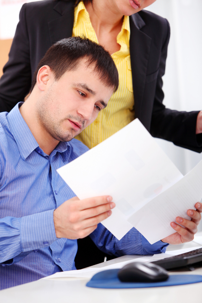 man looking at papers